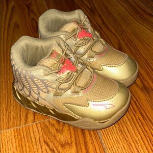 Kids Metallic Gold Puma MELO Athletic Sneakers with Pink Accents